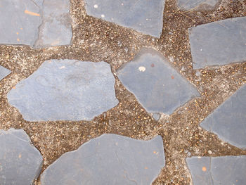 High angle view of stones on footpath