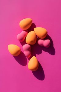 Makeup sponges on pink background