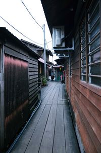 Walkway amidst buildings