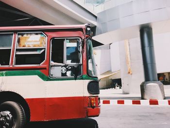 Red car parked in front of building