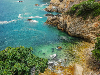 High angle view of rocks in sea