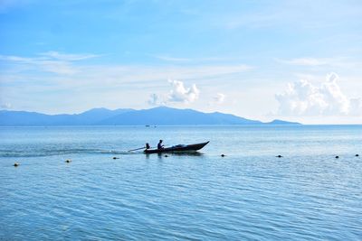 Scenic view of sea against blue sky