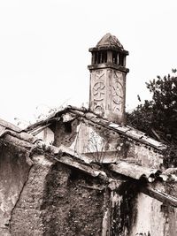 Low angle view of bell tower against clear sky