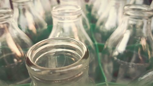 Full frame shot of milk bottles in crate