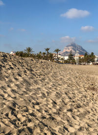 Scenic view of sandy beach against sky