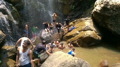 People standing on rock formation