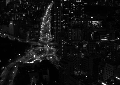 Illuminated modern buildings in city at night