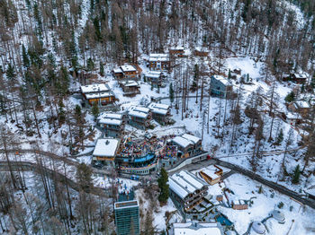 Aerial view on zermatt valley and luxury hotel with people partying