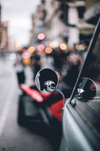 Close-up of car on city