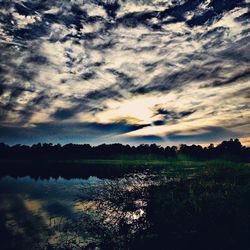 Scenic view of landscape against cloudy sky