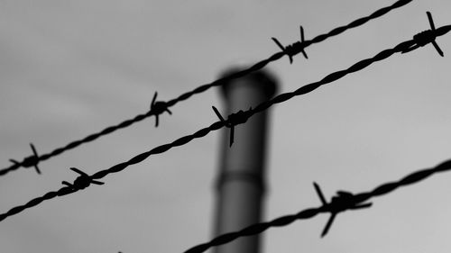 Close-up of barbed wire fence