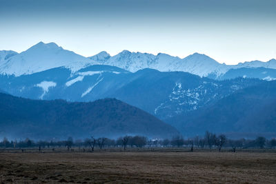 Scenic view of snowcapped mountains against sky