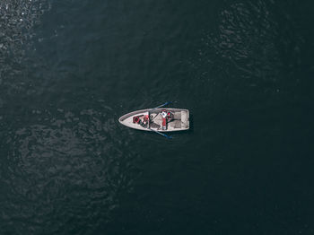 Directly above shot of woman sitting in boat on sea