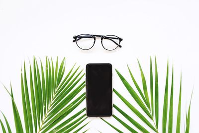 Close-up of eyeglasses against white background