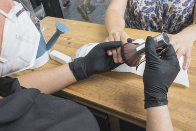 High angle view of people working on table