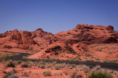 Scenic view of rocky mountains against clear blue sky