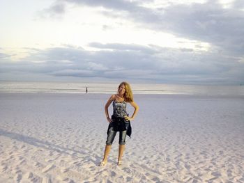 Full length of man on beach against sky