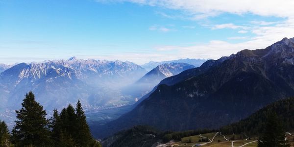 Scenic view of snowcapped mountains against sky