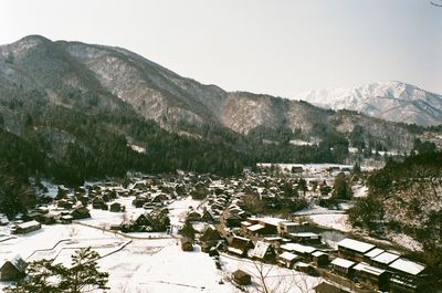 Scenic view of snowcapped mountains against clear sky