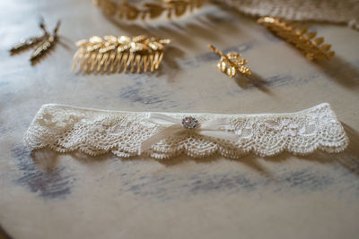 Close-up of garter belt on table