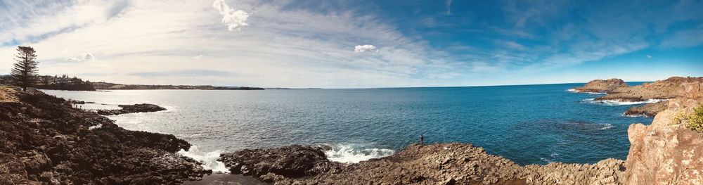 Panoramic view of bay against sky