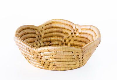 Close-up of wicker basket against white background