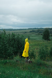 Rear view of yellow person on field