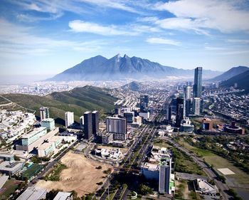 High angle view of buildings in city against sky