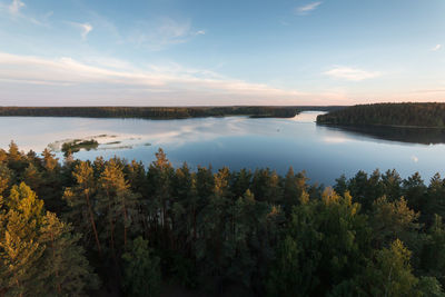 Scenic view of lake against sky during sunset