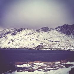 Scenic view of snow covered mountains