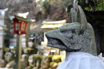 Close-up of statue against temple