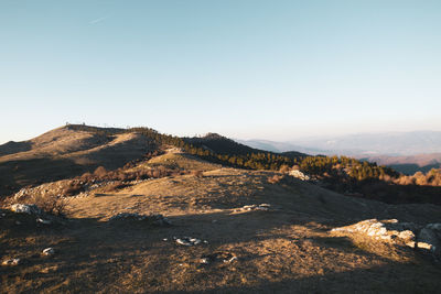 Scenic view of rocky mountains against clear sky