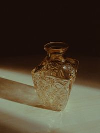 Close-up of glass bottle on table