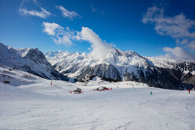 Scenic view of snowcapped mountains against sky