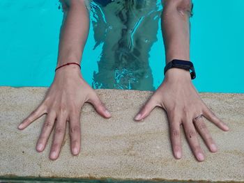 Low section of woman in swimming pool