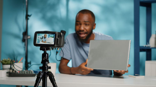 Portrait of young man using mobile phone