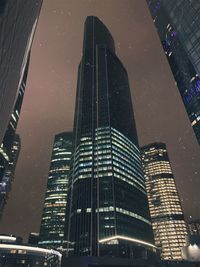 Low angle view of modern buildings at night