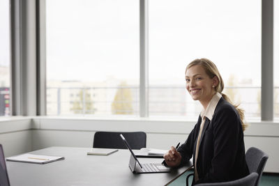 Businesswoman working in boardroom