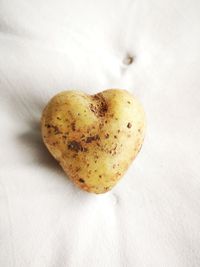 High angle view of heart shape on white table