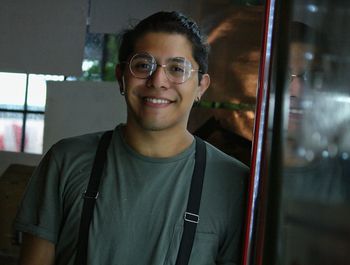 Portrait of smiling young man in eyeglasses