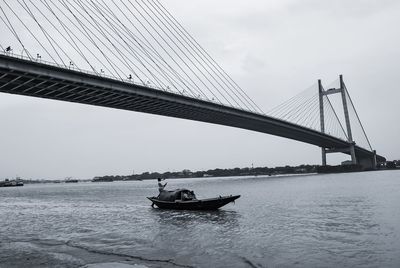 Bridge over sea against sky