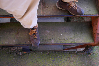 Low section of woman standing outdoors