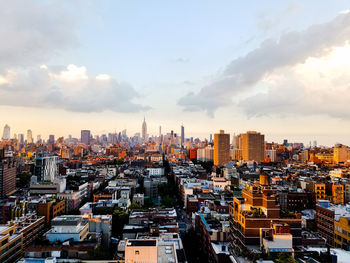 Cityscape against cloudy sky