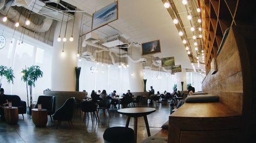 Chairs and tables in illuminated room