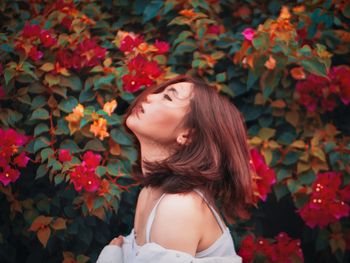 Young woman looking at plants