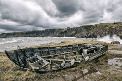 Abandoned boat at beach