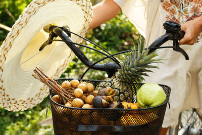 Woman with fruits and hat