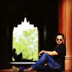 Portrait of man sitting in building