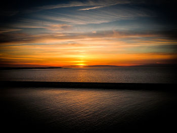 Scenic view of sea at sunset