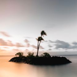 Scenic view of sea against sky at sunset